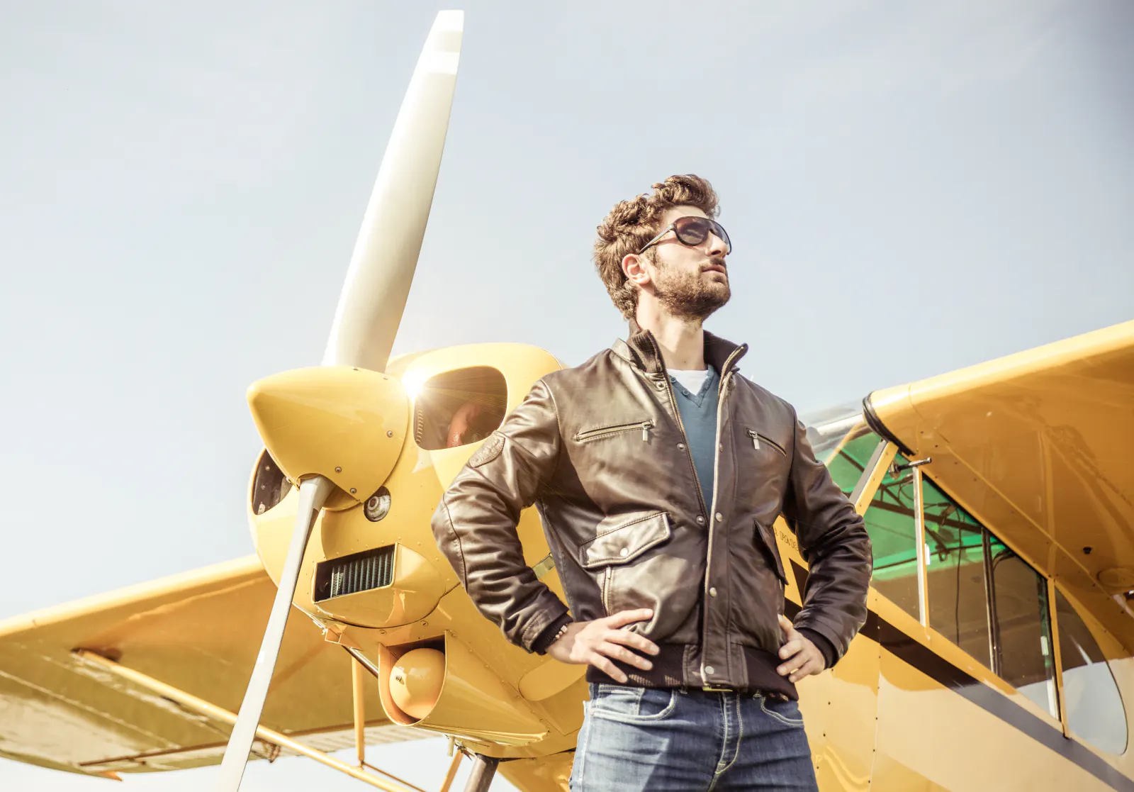 Pilot standing in front of aircraft